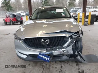 2020 Mazda CX-5 Grand Touring with VIN JM3KFADM0L0738693, listed as a IAAI auction lot 41725906 with 63,629 mi miles. Bid and sale history available at carsss.com. Image 13.