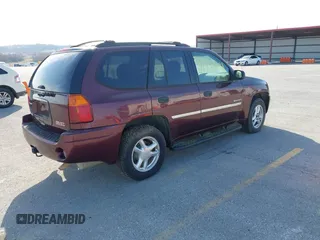 2006 GMC Envoy SLE z VIN 1GKDT13S762328884, wystawiony jako IAAI lot #41778198 z przebiegiem Nie podano mil oraz . Historia ofert i sprzedaży dostępna na DreamBid. Obrazek 4.