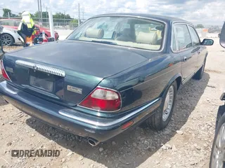 1999 Jaguar XJ with VIN SAJKD6048XC869099, listed as a IAAI auction lot 42761055 with 124,326 mi miles and . Bid and sale history available at DreamBid. Image 4.
