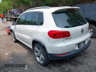 2014 Volkswagen Tiguan SEL with VIN WVGAV3AX7EW022239, listed as a IAAI auction lot 42381670 with 180,729 mi miles and . Bid and sale history available at DreamBid. Image 3.