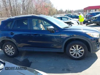2016 Mazda CX-5 Touring with VIN JM3KE4CY0G0631786, listed as a IAAI auction lot 41761214 with 220,058 mi miles. Bid and sale history available at carsss.com. Image 13.