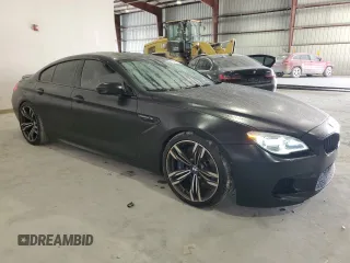 2016 BMW M6 z VIN WBS6E9C53GGF92658, wystawiony jako Copart lot #79003953 z przebiegiem 49 231 mil mil oraz . Historia ofert i sprzedaży dostępna na DreamBid. Obrazek 4.