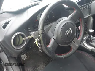 2015 Scion FR-S z VIN JF1ZNAA10F9704134, wystawiony jako IAAI lot #42167308 z przebiegiem 130 242 mil mil oraz . Historia ofert i sprzedaży dostępna na DreamBid. Obrazek 11.