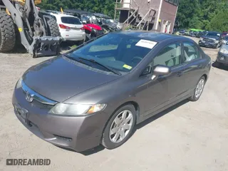2010 Honda Civic Sdn LX with VIN 2HGFA1F57AH587327, listed as a IAAI auction lot 40209466 with 121,228 mi miles. Bid and sale history available at carsss.com. Image 2.
