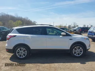 2018 Ford Escape SE z VIN 1FMCU9GD4JUB06181, wystawiony jako IAAI lot #42046708 z przebiegiem 160 987 mil mil oraz . Historia ofert i sprzedaży dostępna na DreamBid. Obrazek 14.