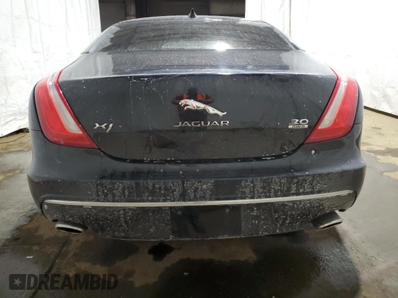 2016 Jaguar XJ with VIN SAJXJ1GD2G8V98776, listed as a Copart auction lot 41959995 with 77,391 mi miles and Salvage title. Bid and sale history available at DreamBid. Image 6.
