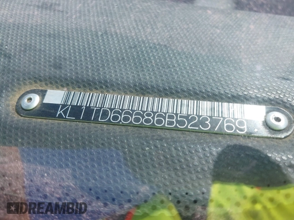 2006 Chevrolet Aveo LS z VIN KL1TD66686B523769, wystawiony jako IAAI lot #42835077 z przebiegiem Nie podano mil oraz . Historia ofert i sprzedaży dostępna na DreamBid. Obrazek 9.