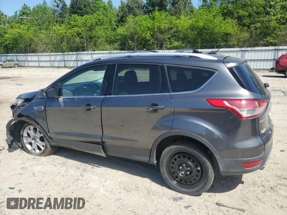2015 Ford Escape Titanium with VIN 1FMCU9J92FUC74879, listed as a Copart auction lot 54683185 with 143,436 mi miles and Salvage title. Bid and sale history available at DreamBid. Image 2.