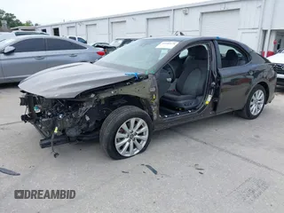 2019 Toyota Camry LE with VIN 4T1B11HKXKU818442, listed as a IAAI auction lot 41906128 with 30,728 mi miles and . Bid and sale history available at DreamBid. Image 2.