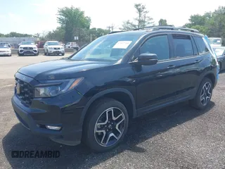 2023 Honda Passport Elite with VIN 5FNYF8H01PB030270, listed as a IAAI auction lot 42667744 with 7,931 mi miles and . Bid and sale history available at DreamBid. Image 2.