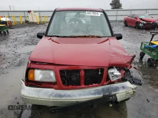 1998 Suzuki Sidekick z VIN JS3TD21VXW4103386, wystawiony jako Copart lot #86219924 z przebiegiem 172 959 mil mil oraz Szkody całkowita. Historia ofert i sprzedaży dostępna na DreamBid. Obrazek 5.