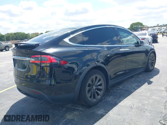 2017 Tesla Model X 90D with VIN 5YJXCBE21HF054898, listed as a IAAI auction lot 42076462 with 89,996 mi miles and . Bid and sale history available at DreamBid. Image 4.