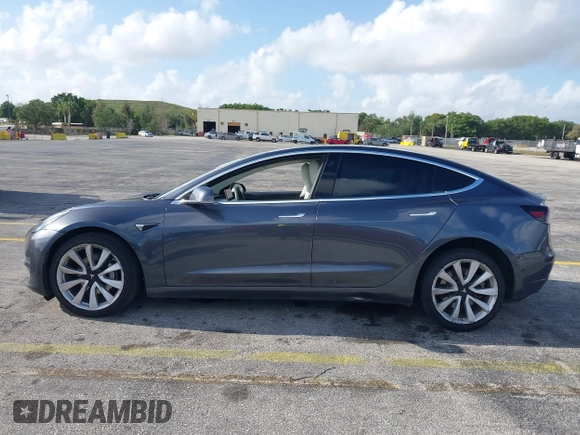 2020 Tesla Model 3 Standard Range Plus with VIN 5YJ3E1EA0LF744046, listed as a IAAI auction lot 41939894 with 102,576 mi miles. Bid and sale history available at carsss.com. Image 14.