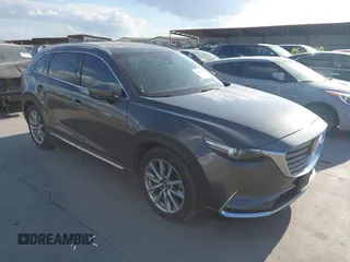 2016 Mazda CX-9 Grand Touring with VIN JM3TCADY8G0114940, listed as a IAAI auction lot 40701187 with 112,311 mi miles and . Bid and sale history available at DreamBid. Image 1.