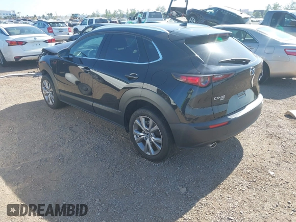 2022 Mazda CX-30 S Premium with VIN 3MVDMBDL6NM407913, listed as a IAAI auction lot 42359860 with 35,804 mi miles and . Bid and sale history available at DreamBid. Image 3.