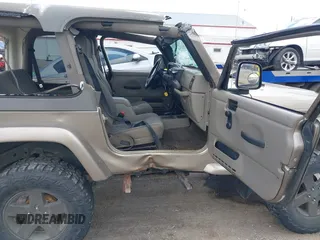 2004 Jeep Wrangler Sahara with VIN 1J4FA59S54P740417, listed as a IAAI auction lot 42382078 with 200,108 mi miles and . Bid and sale history available at DreamBid. Image 5.