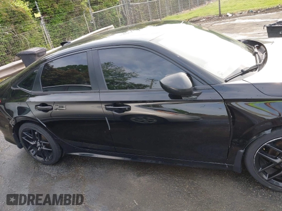 2022 Honda Civic Sport z VIN 2HGFE2F50NH604212, wystawiony jako IAAI lot #42042596 z przebiegiem 40 634 mil mil oraz . Historia ofert i sprzedaży dostępna na DreamBid. Obrazek 13.