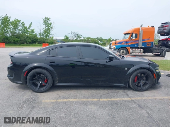 2020 Dodge Charger SRT Hellcat z VIN 2C3CDXL9XLH134202, wystawiony jako IAAI lot #42402856 z przebiegiem 24 675 mil mil oraz . Historia ofert i sprzedaży dostępna na DreamBid. Obrazek 13.
