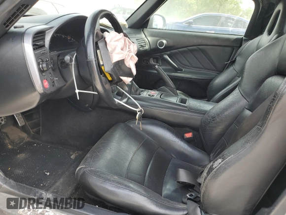 2002 Honda S2000 z VIN JHMAP11472T005753, wystawiony jako Copart lot #54002225 z przebiegiem 156 893 mil mil oraz Czysty tytuł • Clean title. Historia ofert i sprzedaży dostępna na DreamBid. Obrazek 7.