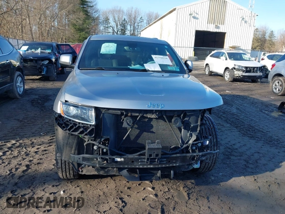 2015 Jeep Grand Cherokee Laredo with VIN 1C4RJFAG9FC775004, listed as a IAAI auction lot 41754534 with 116,893 mi miles. Bid and sale history available at carsss.com. Image 12.