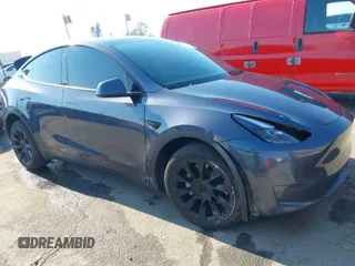2022 Tesla Model Y Long Range z VIN 7SAYGDEE4NF522698, wystawiony jako IAAI lot #41287885 z przebiegiem 82 306 mil mil oraz . Historia ofert i sprzedaży dostępna na DreamBid. Obrazek 1.