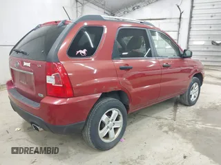 2009 Kia Sportage LX with VIN KNDJE723497555026, listed as a IAAI auction lot 42102679 with 136,398 mi miles. Bid and sale history available at carsss.com. Image 4.