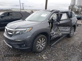2022 Honda Pilot EX-L with VIN 5FNYF6H57NB038144, listed as a IAAI auction lot 41066857 with 24,551 mi miles. Bid and sale history available at carsss.com. Image 2.