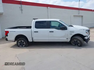 2023 Ford F-150 Lightning Pro with VIN 1FTVW1EL2PWG18764, listed as a IAAI auction lot 41908278 with 16,276 mi miles and . Bid and sale history available at DreamBid. Image 13.