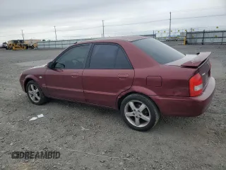 2002 Mazda Protege DX z VIN JM1BJ225320636991, wystawiony jako Copart lot #57915265 z przebiegiem 123 371 mil mil oraz Szkoda całkowita • Salvage title. Historia ofert i sprzedaży dostępna na DreamBid. Obrazek 2.