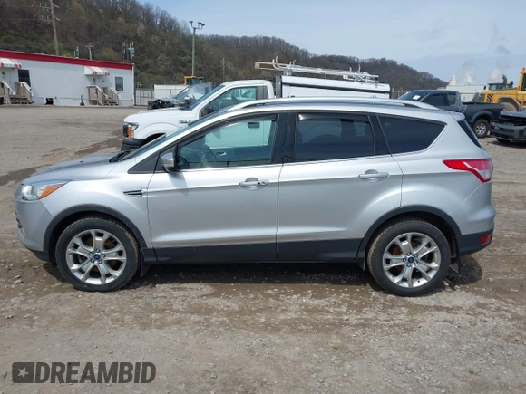 2016 Ford Escape Titanium with VIN 1FMCU9JX3GUA62802, listed as a IAAI auction lot 42001690 with 124,452 mi miles. Bid and sale history available at carsss.com. Image 14.