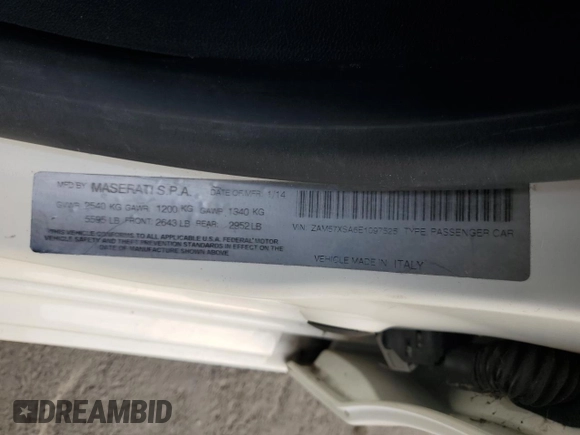 2014 Maserati Ghibli z VIN ZAM57XSA6E1097525, wystawiony jako Copart lot #42029695 z przebiegiem 93 740 mil mil oraz Szkoda całkowita • Salvage title. Historia ofert i sprzedaży dostępna na DreamBid. Obrazek 12.
