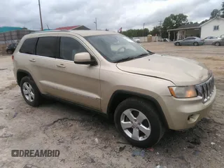 2012 Jeep Grand Cherokee Laredo with VIN 1C4RJEAGXCC157616, listed as a IAAI auction lot 42156539 with 301,661 mi miles. Bid and sale history available at carsss.com. Image 1.