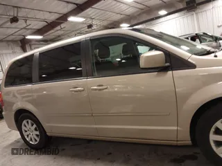 2013 Dodge Grand Caravan SXT with VIN 2C4RDGCG0DR567186, listed as a IAAI auction lot 41706119 with 112,512 mi miles and . Bid and sale history available at DreamBid. Image 14.