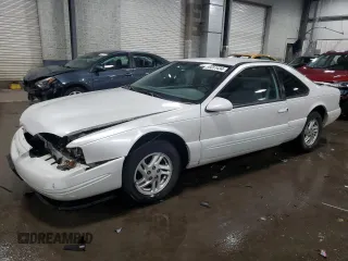 1997 Ford Thunderbird LX with VIN 1FALP6249VH167869, listed as a Copart auction lot 86851434 with 40,490 mi miles and Salvage Title. Bid and sale history available at DreamBid. Image 1.