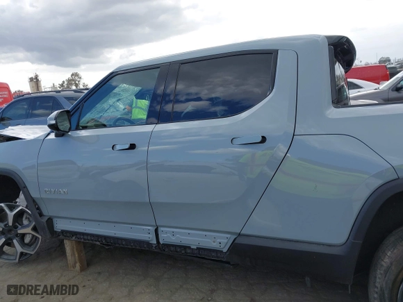 2023 Rivian R1T Adventure with VIN 7FCTGBAA9PN027894, listed as a IAAI auction lot 42061339 with 5,047 mi miles. Bid and sale history available at carsss.com. Image 14.