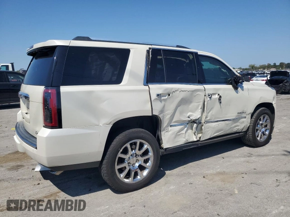 2015 GMC Yukon Denali with VIN 1GKS2CKJ3FR663324, listed as a Copart auction lot 70306614 with 154,234 mi miles and Salvage Title. Bid and sale history available at carsss.com. Image 3.
