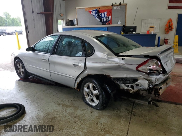 2005 Ford Taurus SE with VIN 1FAFP53215A133518, listed as a Copart auction lot 59615205 with 127,778 mi miles and Salvage title. Bid and sale history available at DreamBid. Image 2.