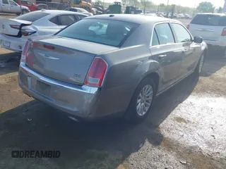 2014 Chrysler 300 with VIN 2C3CCAAG4EH159911, listed as a IAAI auction lot 41963042 with 105,972 mi miles and . Bid and sale history available at DreamBid. Image 4.