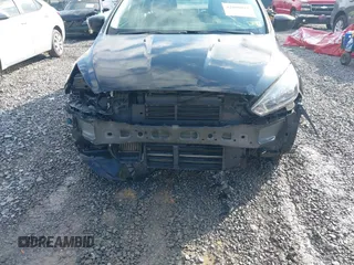 2018 Ford Focus SE z VIN 1FADP3FE9JL255818, wystawiony jako IAAI lot #42009017 z przebiegiem 79 329 mil mil oraz . Historia ofert i sprzedaży dostępna na DreamBid. Obrazek 6.
