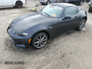2021 Mazda MX-5 Miata Grand Touring with VIN JM1NDAM76M0457795, listed as a Copart auction lot 81306864 with 27,036 mi miles and Salvage title. Bid and sale history available at DreamBid. Image 1.