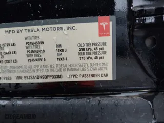 2013 Tesla Model S with VIN 5YJSA1DN9DFP03380, listed as a IAAI auction lot 41865213 with 184,831 mi miles. Bid and sale history available at carsss.com. Image 9.