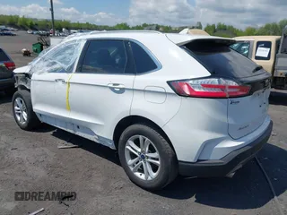 2020 Ford Edge SEL z VIN 2FMPK4J95LBA31157, wystawiony jako IAAI lot #42225863 z przebiegiem 96 082 mil mil oraz . Historia ofert i sprzedaży dostępna na DreamBid. Obrazek 3.