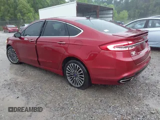 2018 Ford Fusion Titanium with VIN 3FA6P0D91JR233679, listed as a IAAI auction lot 42182140 with 100,706 mi miles and . Bid and sale history available at DreamBid. Image 3.