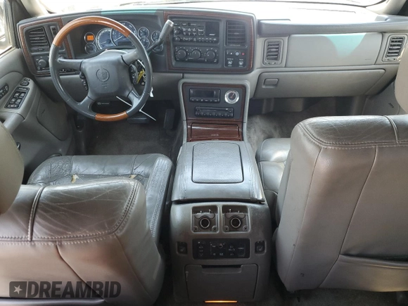 2002 Cadillac Escalade z VIN 1GYEC63T42R189976, wystawiony jako Copart lot #57852565 z przebiegiem 243 089 mil mil oraz Szkody całkowita. Historia ofert i sprzedaży dostępna na DreamBid. Obrazek 8.