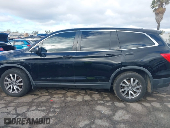 2019 Honda Pilot EX-L with VIN 5FNYF5H51KB013763, listed as a IAAI auction lot 41711089 with 79,651 mi miles and . Bid and sale history available at DreamBid. Image 14.