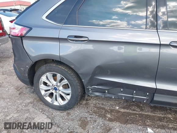 2021 Ford Edge Titanium z VIN 2FMPK3K9XMBA21766, wystawiony jako IAAI lot #42187940 z przebiegiem 79 732 mil mil oraz . Historia ofert i sprzedaży dostępna na DreamBid. Obrazek 18.