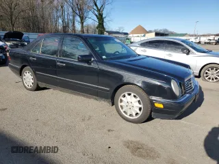 1996 Mercedes-Benz E Class with VIN WDBJF20F9TJ023003, listed as a Copart auction lot 86356784 with 230,944 mi miles and Salvage Title. Bid and sale history available at carsss.com. Image 4.