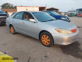 2002 Toyota Camry LE with VIN 4T1BE32K42U011553, listed as a IAAI auction lot 42054226 with 223,683 mi miles. Bid and sale history available at carsss.com. Image 1.