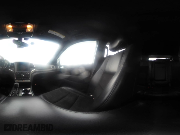 2018 Jeep Grand Cherokee Laredo E with VIN 1C4RJFAG1JC499457, listed as a IAAI auction lot 41379459 with 127,344 mi miles and . Bid and sale history available at DreamBid. Image 19.
