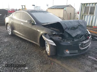 2015 Tesla Model S 85D with VIN 5YJSA4H44FF085973, listed as a IAAI auction lot 41134045 with 111,246 mi miles. Bid and sale history available at carsss.com. Image 1.